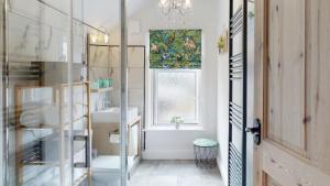 a bathroom with a sink and a window at Princely House Corporate, business & family Home in Mansfield