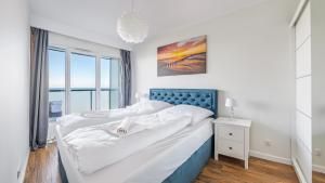 Posteľ alebo postele v izbe v ubytovaní Prywatne apartamenty Sun & Snow w obiekcie Ustronie Apartments