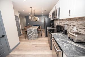 a kitchen with a counter top and a dining room at Dawsonville Retreat in Dawsonville +7 photos