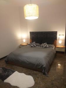 Postel nebo postele na pokoji v ubytování Executive center rooms