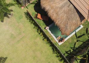 an overhead view of a person laying on the grass at POUSADA ZAYA in São Miguel dos Milagres