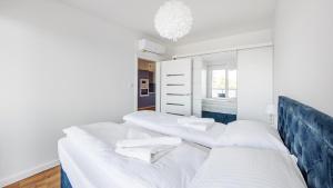 Posteľ alebo postele v izbe v ubytovaní Prywatne apartamenty Sun & Snow w obiekcie Ustronie Apartments