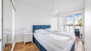 Posteľ alebo postele v izbe v ubytovaní Prywatne apartamenty Sun & Snow w obiekcie Ustronie Apartments