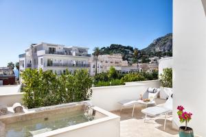 a balcony with a view of the city at Pazziella Garden & Suites in Capri