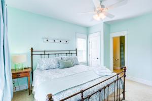 a bedroom with a bed and a ceiling fan at The Lost Lobstah 969 in Avon +49 photos