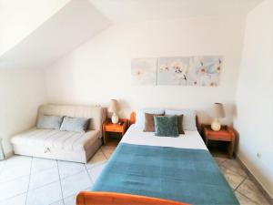 Postel nebo postele na pokoji v ubytování Apartments Villa Kukoljac