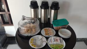 a table with food and a coffee maker on it at HOTEL FERMOZA in Formosa