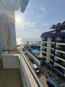 a view of the ocean from the balcony of a building at Orange Grove Apart Hotel in Alanya