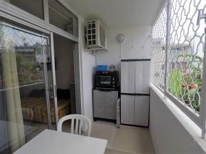 A kitchen or kitchenette at Studio Marina pointe du bout vue sur le port