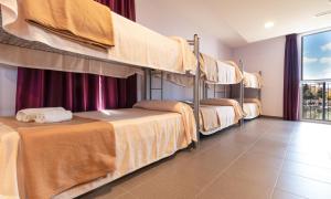 Cama o camas de una habitación en Albergue "El Río"