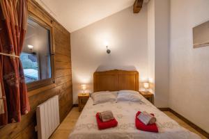 Ένα ή περισσότερα κρεβάτια σε δωμάτιο στο Au chalet du Nant d'ant