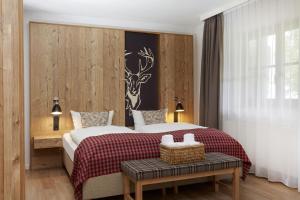 Postel nebo postele na pokoji v ubytování HYPERION Hotel Garmisch - Partenkirchen