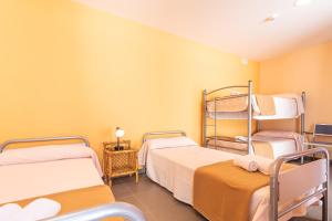 Cama o camas de una habitación en Albergue "El Río"