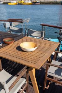 a wooden table with a bowl on top of a boat at Minty of Kip in Lisbon