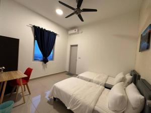 a bedroom with a bed and a ceiling fan at AX Residence in Johor Bahru +18 photos