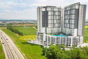 an aerial view of a large building with a highway at AX Residence in Johor Bahru