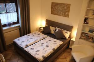 Postel nebo postele na pokoji v ubytování Gäste Apartement Casa Luber + 15 fotografií