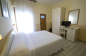 Postel nebo postele na pokoji v ubytování Hotel Riviera