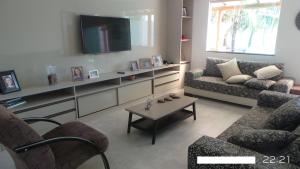 TV o dispositivi per l'intrattenimento presso Excelente casa com Piscina