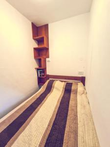 a small bedroom with a bed in a room at The spots - 300m from the Gondola in Brzeće