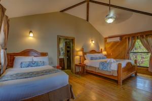 a bedroom with two beds and a window at Anthony's Key Resort in Sandy Bay