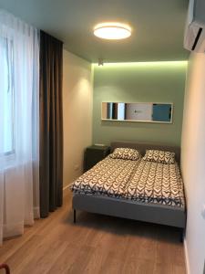 Ένα ή περισσότερα κρεβάτια σε δωμάτιο στο V3 MONIUSZKI 14B - 75m2 - ŚCISŁE CENTRUM