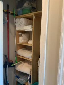 a closet filled with lots of white towels at Comfy Coastal Beach Vacation in Clearwater Beach