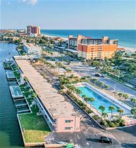 an aerial view of a resort with a swimming pool at Comfy Coastal Beach Vacation in Clearwater Beach