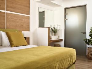 Postel nebo postele na pokoji v ubytování Stefania Apartments