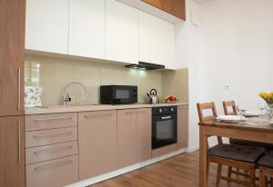 Kuchyňa alebo kuchynka v ubytovaní Luxus Apartament Rodzinny z sauną i siłownią