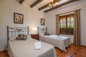 Ένα ή περισσότερα κρεβάτια σε δωμάτιο στο Casa La Atalaya +24 φωτογραφίες