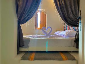 Postel nebo postele na pokoji v ubytování Hôtel Djerba Authentique - Au centre de Midoun