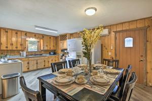 a dining room with a table and chairs in a kitchen at Cozy Graham Retreat about 3 Mi to Lake Eddleman! in Graham
