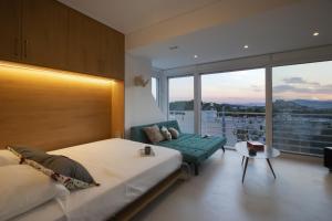 A bed or beds in a room at Stunning Acropolis view apartment