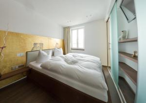 Postel nebo postele na pokoji v ubytování Ringelnatz Warnemünde