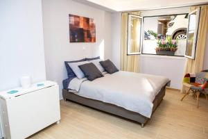 מיטה או מיטות בחדר ב-Studio apartment with all amenities in Kolonaki