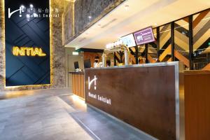 a lobby of a hotel with a reception desk at Hotel Initial-Taichung in Taichung