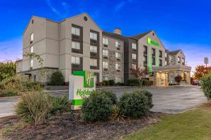 a hotel with a hilton sign in front of a building at Holiday Inn Spartanburg Northwest in Spartanburg
