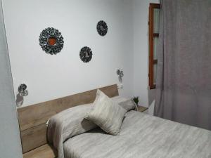 Postel nebo postele na pokoji v ubytování Hostal Puerta Carmona