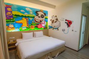 Postel nebo postele na pokoji v ubytování Legend Hotel Kaohsiung Liuhe