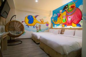 Postel nebo postele na pokoji v ubytování Legend Hotel Kaohsiung Liuhe
