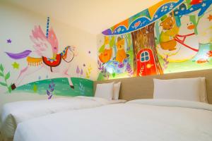 Postel nebo postele na pokoji v ubytování Legend Hotel Kaohsiung Liuhe
