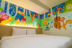 Postel nebo postele na pokoji v ubytování Legend Hotel Kaohsiung Liuhe