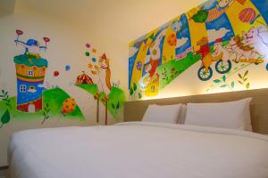 Postel nebo postele na pokoji v ubytování Legend Hotel Kaohsiung Liuhe