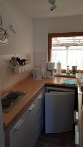 a kitchen with a counter top with appliances on it at Bungalow in Kritzmow