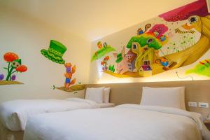 Postel nebo postele na pokoji v ubytování Legend Hotel Kaohsiung Liuhe