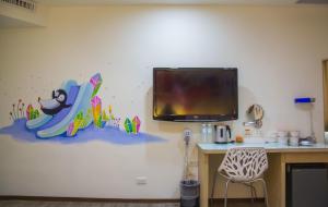 TV a/nebo společenská místnost v ubytování Legend Hotel Kaohsiung Liuhe
