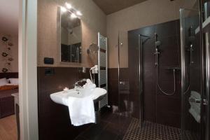 a bathroom with a sink and a shower at Hotel Locanda Stendhal in Colorno +26 photos