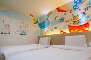 Postel nebo postele na pokoji v ubytování Legend Hotel Kaohsiung Liuhe