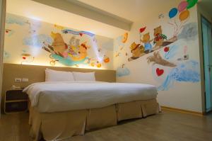 Postel nebo postele na pokoji v ubytování Legend Hotel Kaohsiung Liuhe